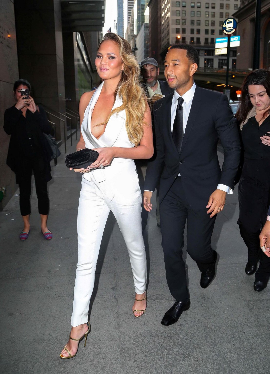 Chrissy Teigen busty  braless wearing a wide open jumpsuit at City Harvests 21st #75165107