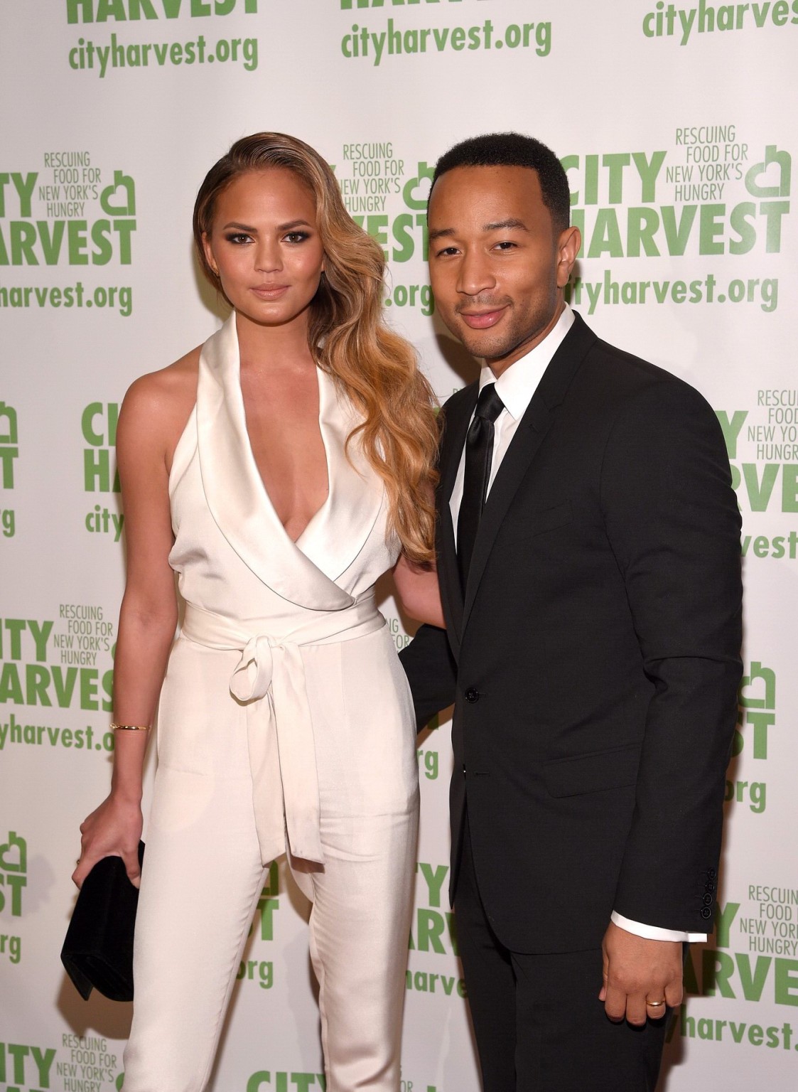 Chrissy Teigen busty  braless wearing a wide open jumpsuit at City Harvests 21st #75165160