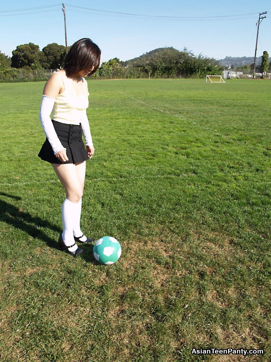 Asian teen playing soccer #69972255