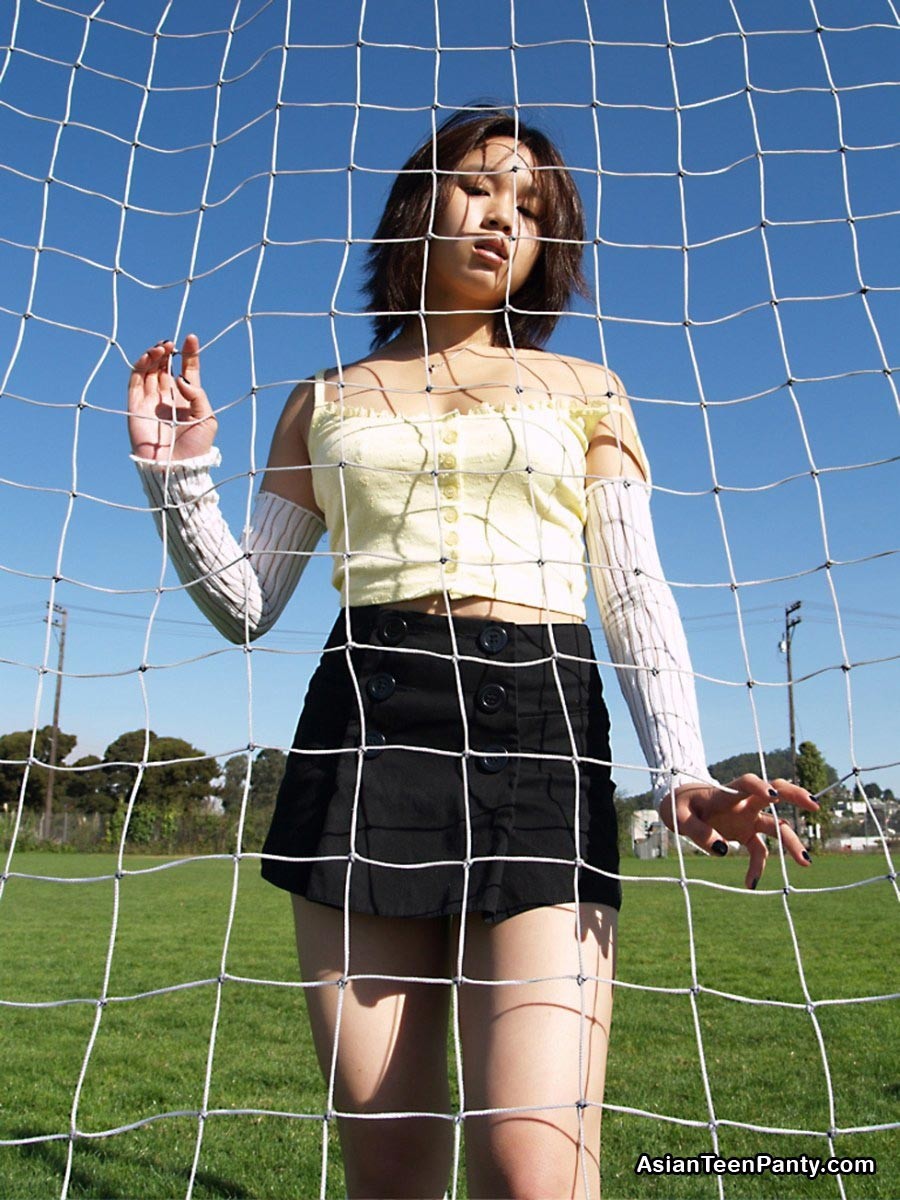 Asian teen playing soccer #69972284