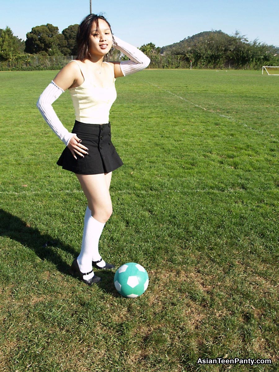 Asian teen playing soccer #69972381
