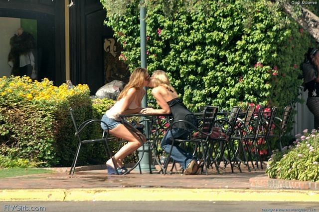 Frisky girls kissing and playing outdoors #70981278