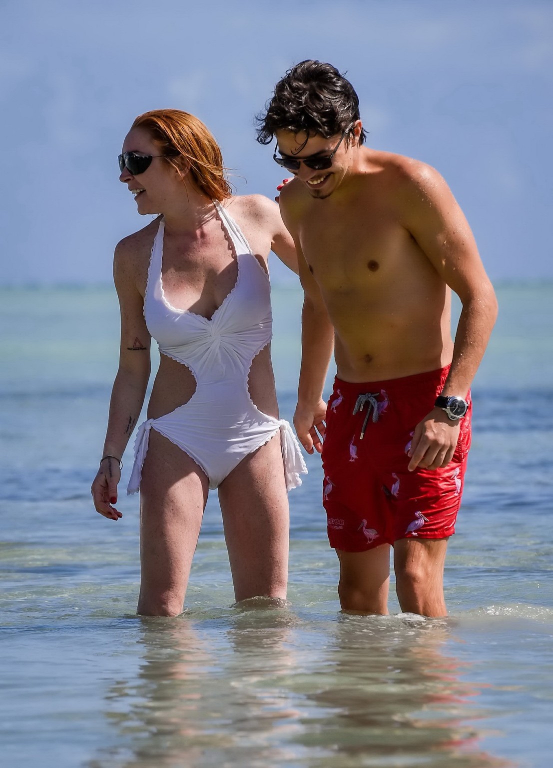 Lindsay Lohan busty showing pokies in white swimsuit #75140853