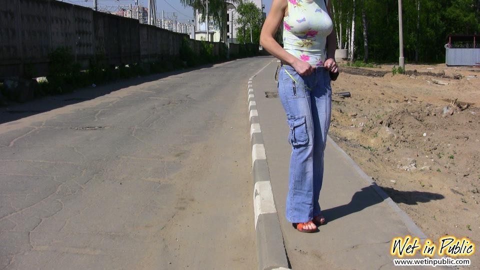 Big-breasted bombshell with long hair pisses in her jeans on the road #73240649