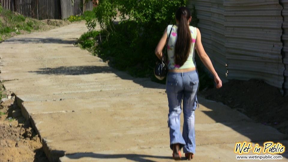 Big-breasted bombshell with long hair pisses in her jeans on the road #73240683