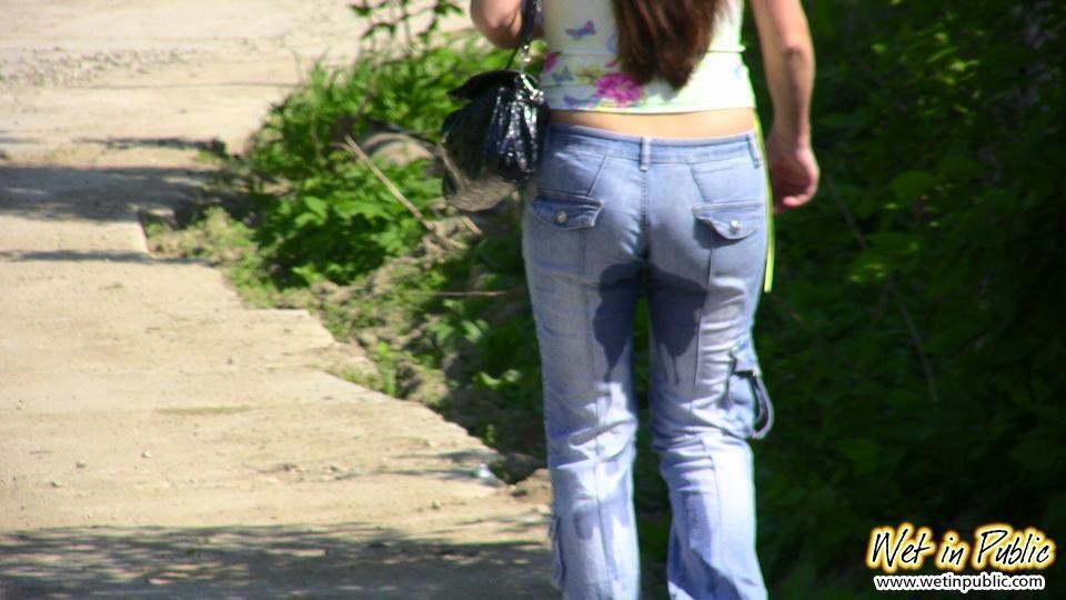 Big-breasted bombshell with long hair pisses in her jeans on the road #73240692