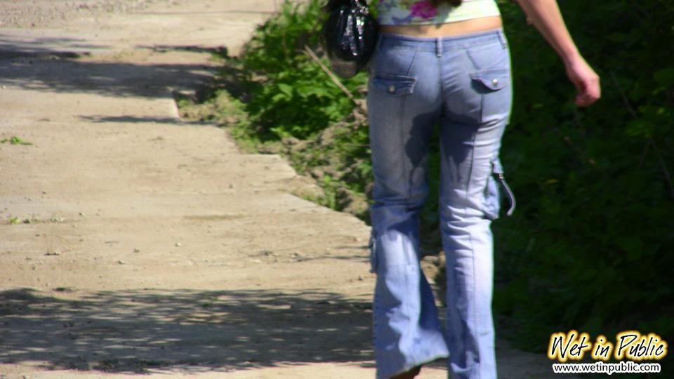 Big-breasted bombshell with long hair pisses in her jeans on the road #73240700