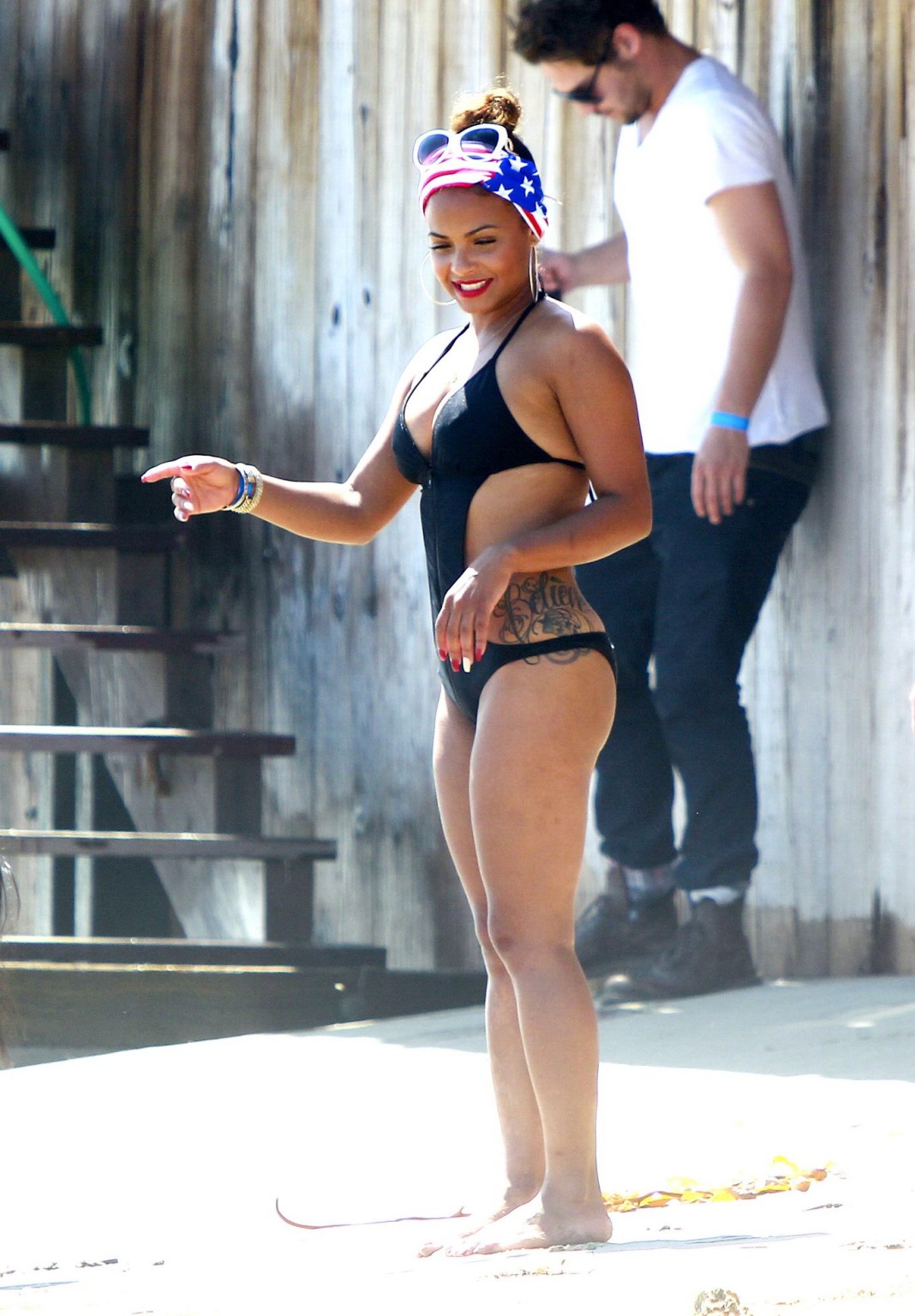 Christina Milian wearing a sexy black swimsuit at Paris Hiltons 4th of July part #75191769