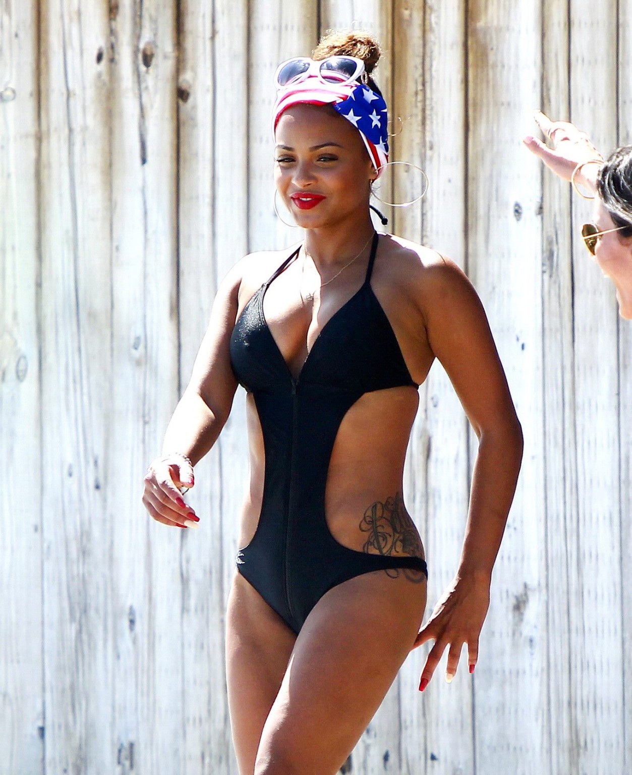 Christina Milian wearing a sexy black swimsuit at Paris Hiltons 4th of July part #75191842