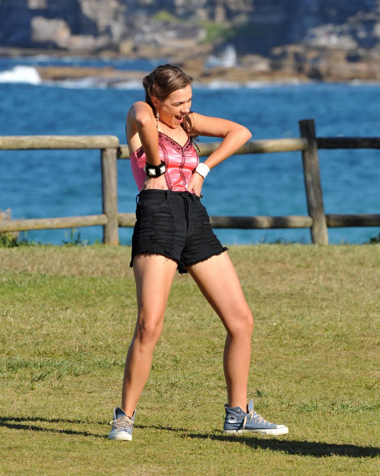 Demi Harman wearing a corset and black shorts on Home  Away set at Palm Beach in #75184861