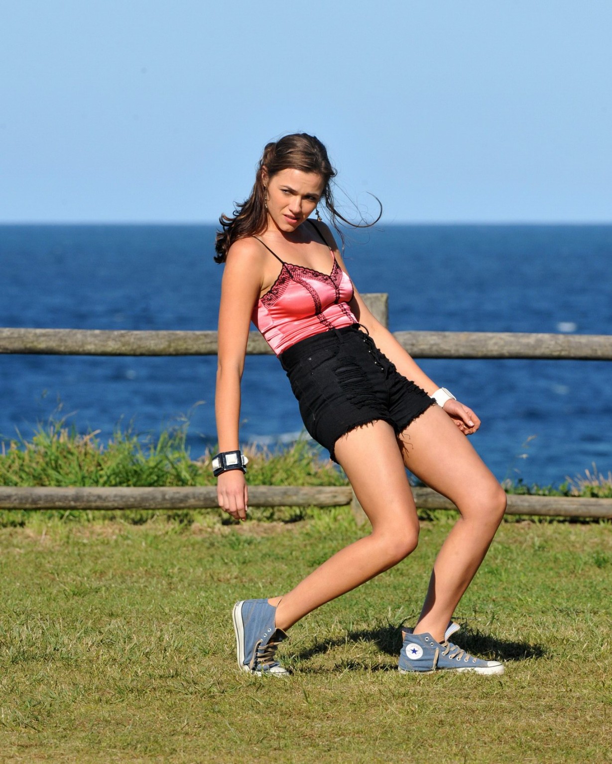 Demi Harman wearing a corset and black shorts on Home  Away set at Palm Beach in #75184875