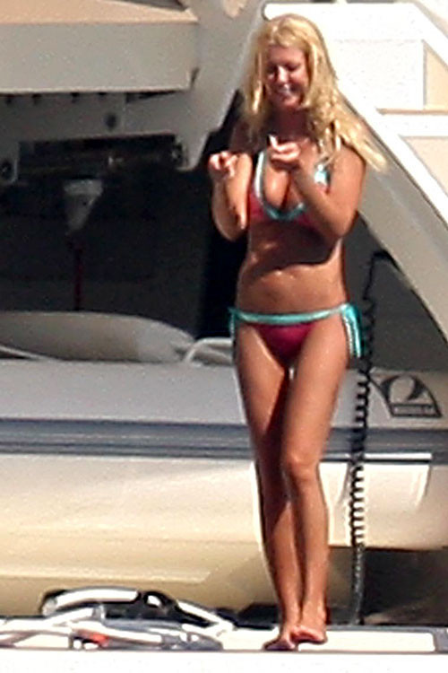 Tara Reid showing her ass in bikini and tits slip paparazzi pictures #75385924