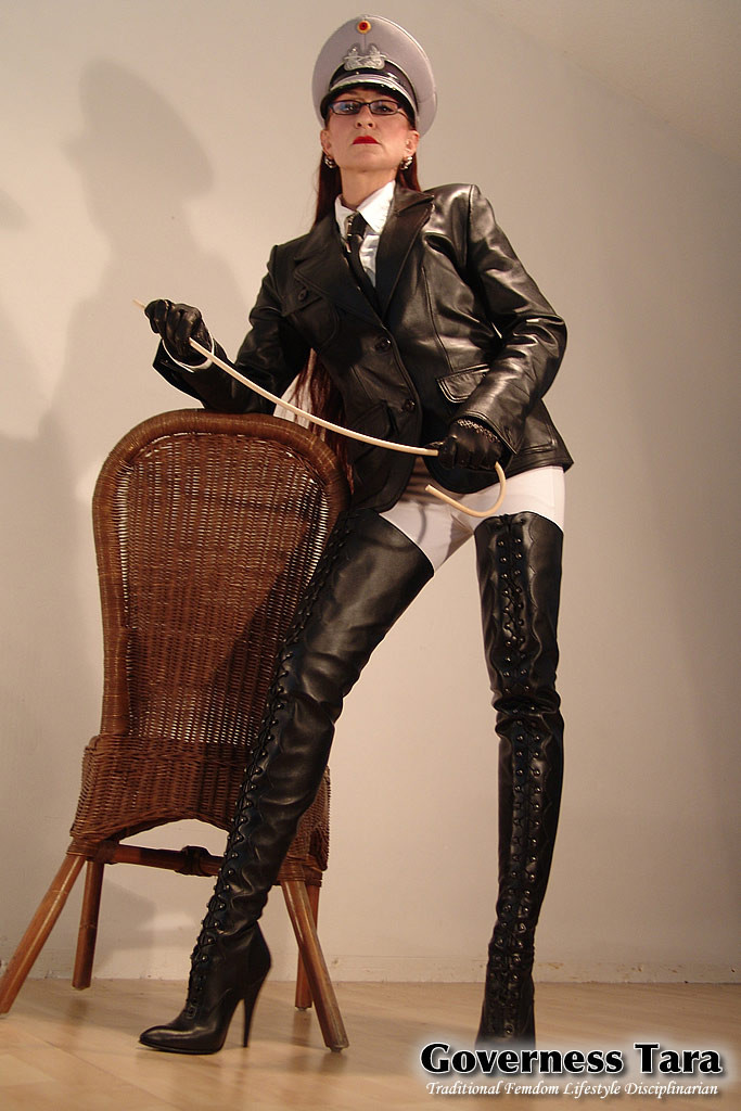 Mature but strict mistress in leather and fur coat posing #72186899