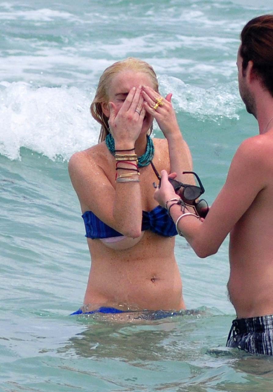 Lindsay Lohan sexy and hot bikini and boob slip paparazzi photos #75303073