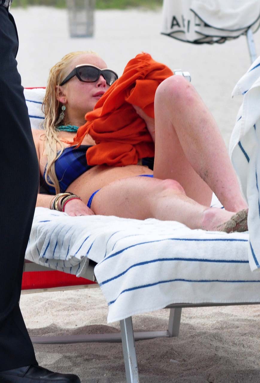 Lindsay Lohan sexy and hot bikini and boob slip paparazzi photos #75303081