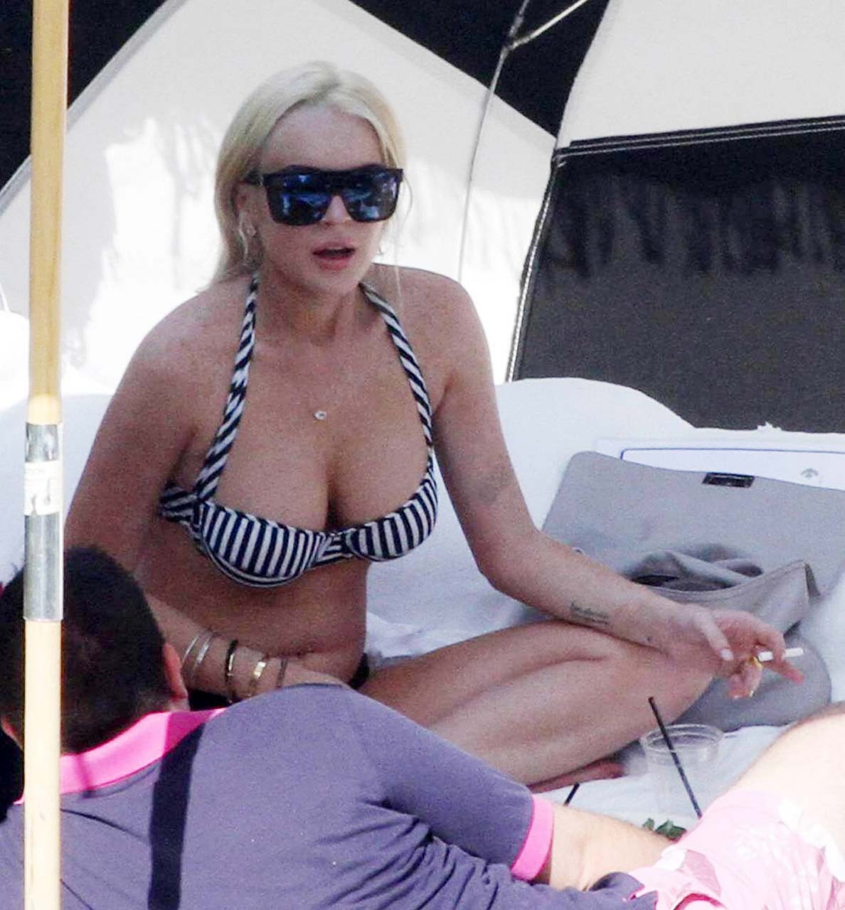 Lindsay Lohan sexy and hot bikini and boob slip paparazzi photos #75303088