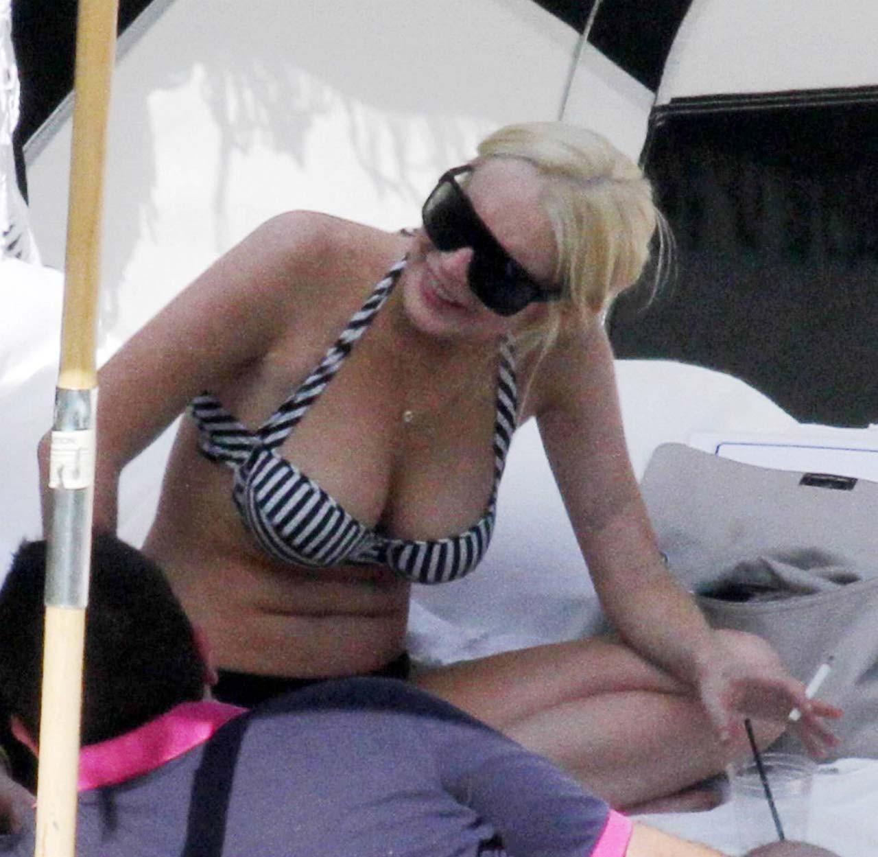 Lindsay Lohan sexy and hot bikini and boob slip paparazzi photos #75303093