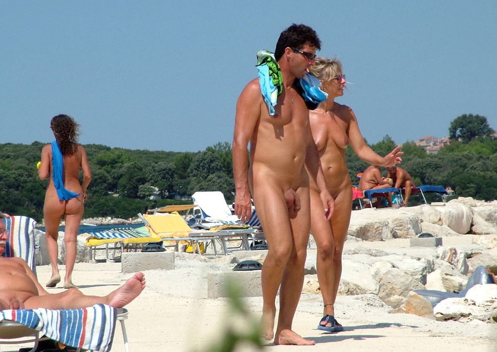 Two nudist friends get an even tan at the beach #72244022
