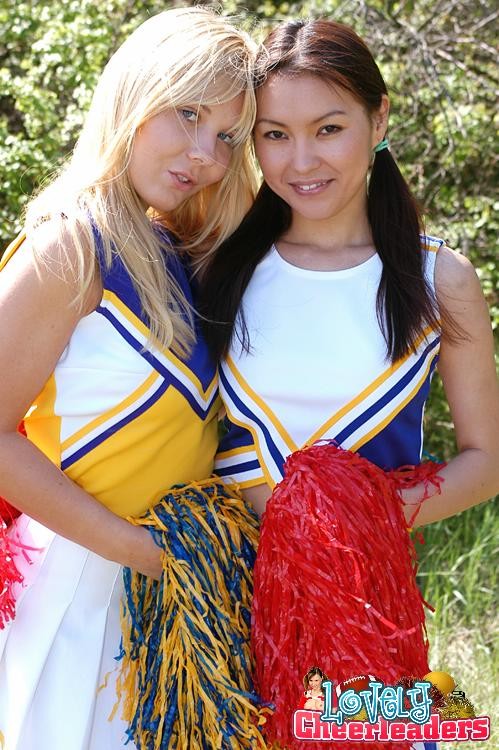 Two heady cheerleaders licking and toying their snatches outdoors #73505982