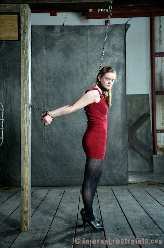 Hazel Hypnotic in red dress is bound in chains and wooden stocks #71980511