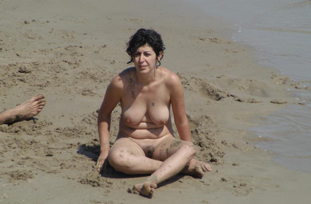 Bigtitted nudist babe lights up at the beach #72244739