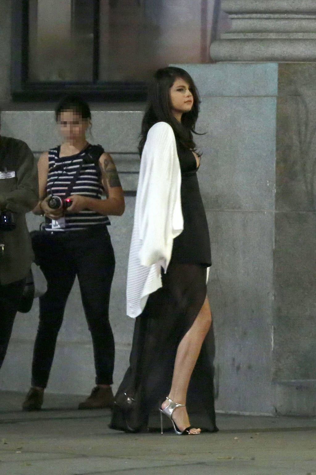 Selena Gomez busty wearing a low cut dress on the set #75155011