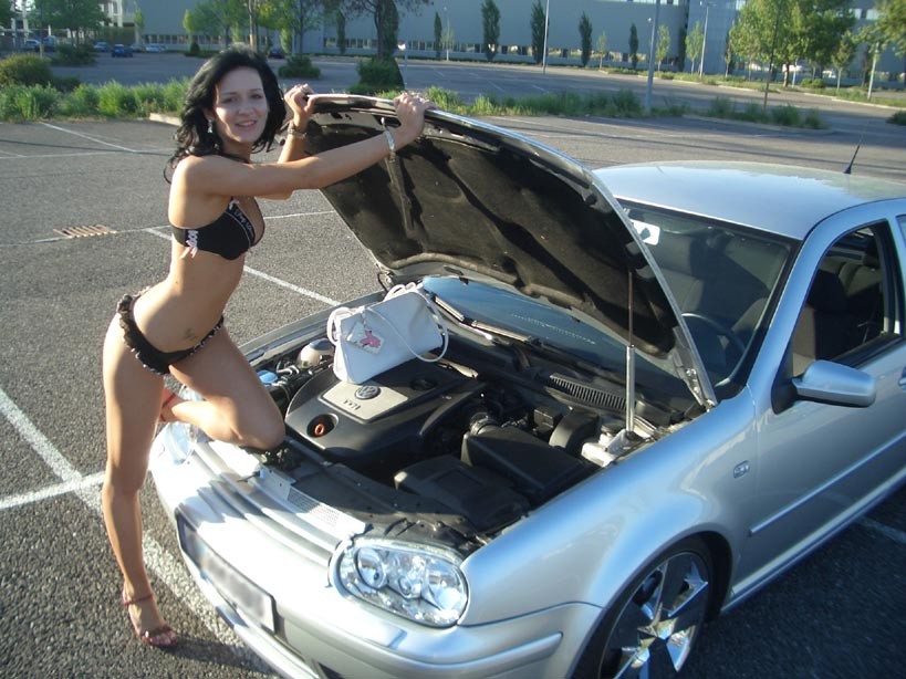 Amateur housewife posing outdoor with her car #70538940
