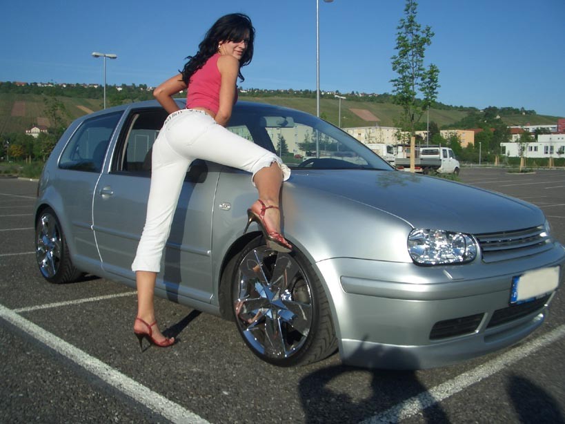 Amateur housewife posing outdoor with her car #70538981
