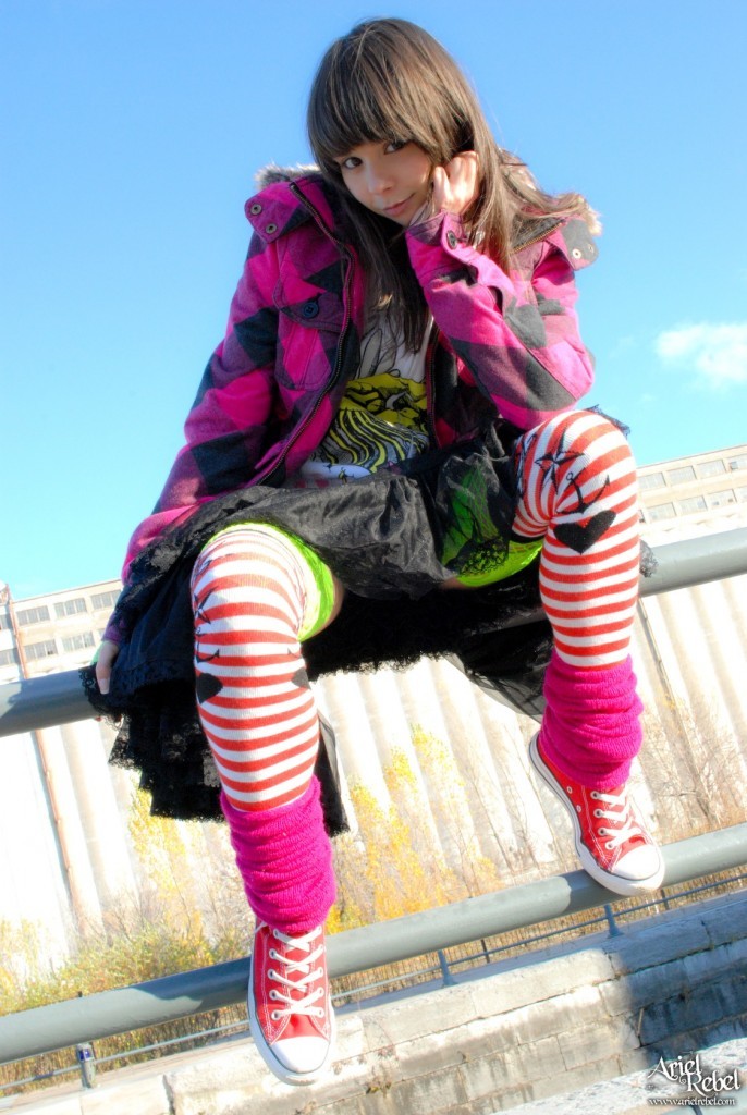 Grunge punk girl outside wearing hoodie #77773426