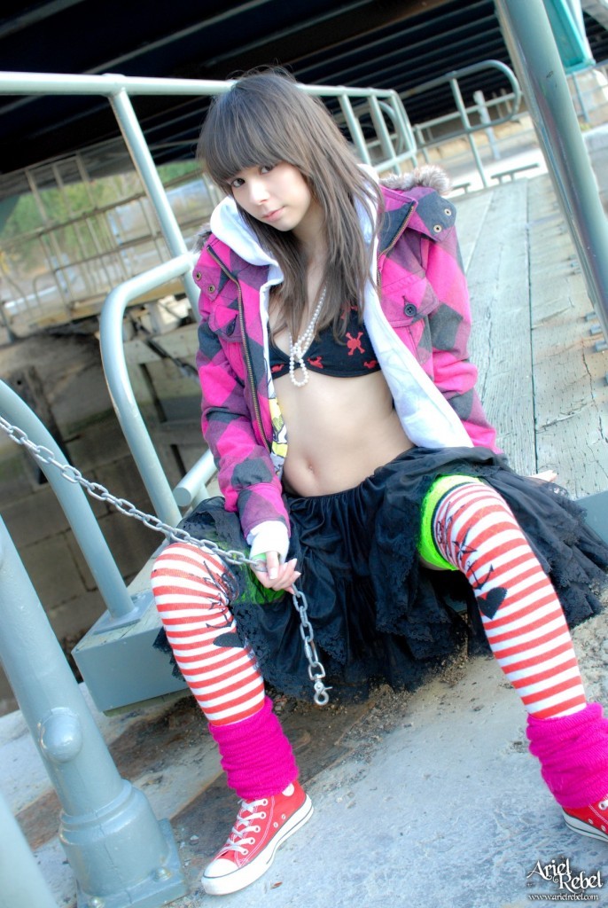 Grunge punk girl outside wearing hoodie #77773438