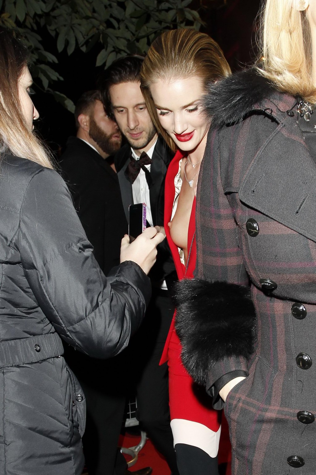 Rosie Huntington-Whiteley braless wearing low cut red outfit at 2013 British Fas #75211039