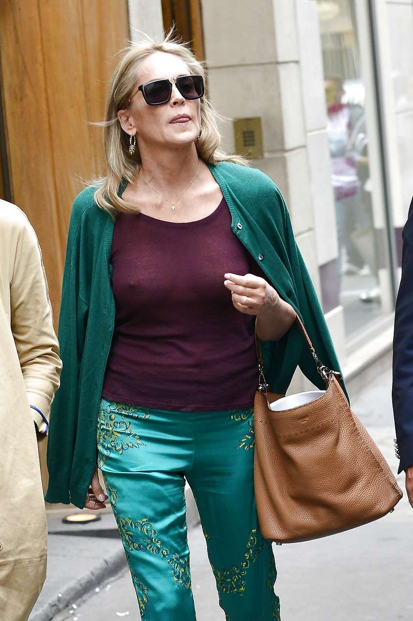 Sharon Stone exposing great boobs in see thru shirt on street #75225752