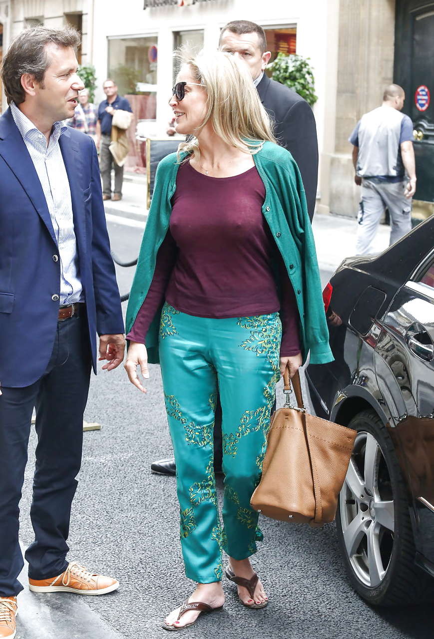 Sharon Stone exposing great boobs in see thru shirt on street #75225779