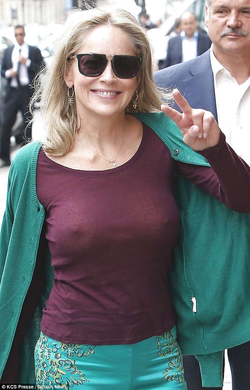 Sharon Stone exposing great boobs in see thru shirt on street #75225801