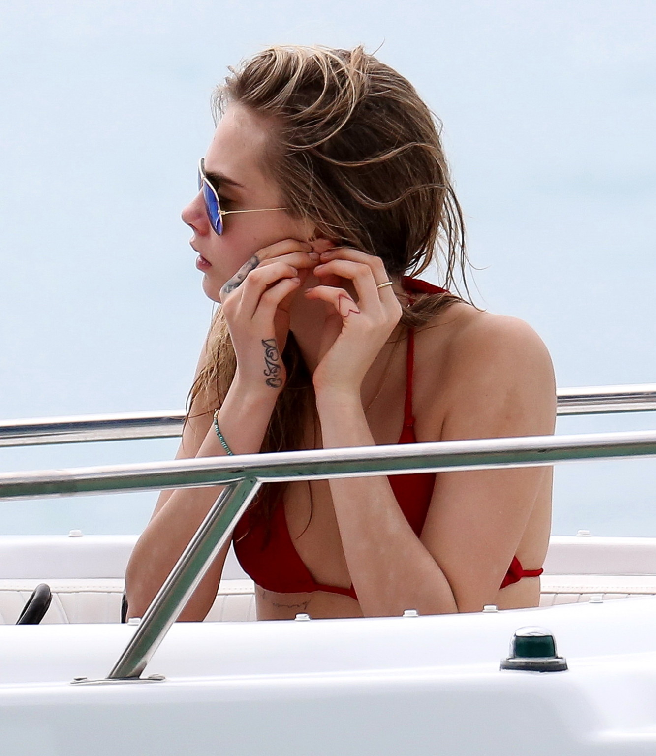 Cara Delevingne showing ass crack in red bikini at the beach in Barbados #75208716