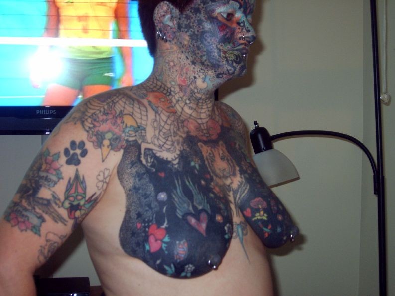 Extreme tattoo and piercing #73229621