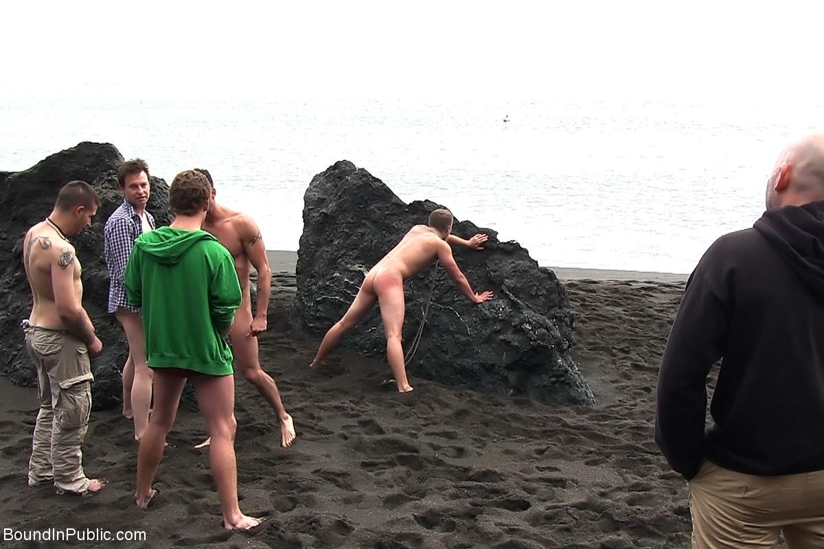 Gay being used and abused outdoor on a public beach. #76900602