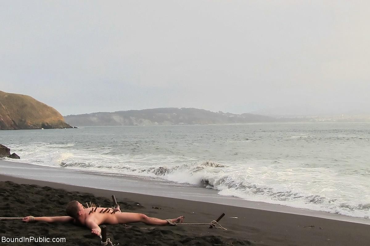 Gay being used and abused outdoor on a public beach. #76900660