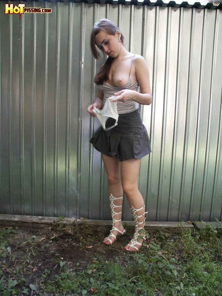 Cutie pissing outdoors #76518974