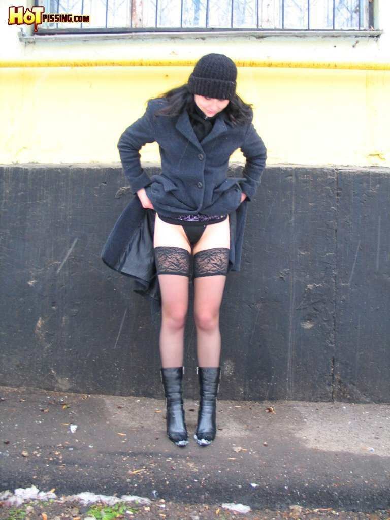 Girl pissing outdoors in the cold #76593252