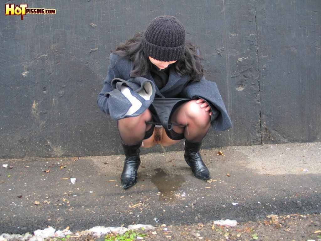 Girl pissing outdoors in the cold #76593278