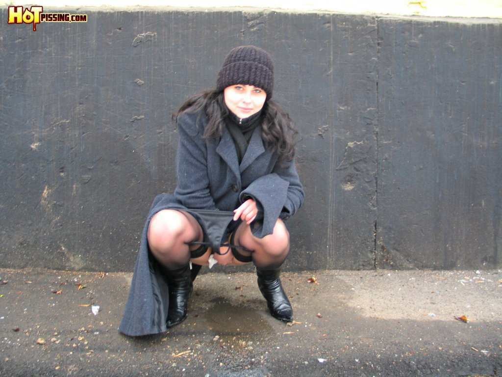 Girl pissing outdoors in the cold #76593296