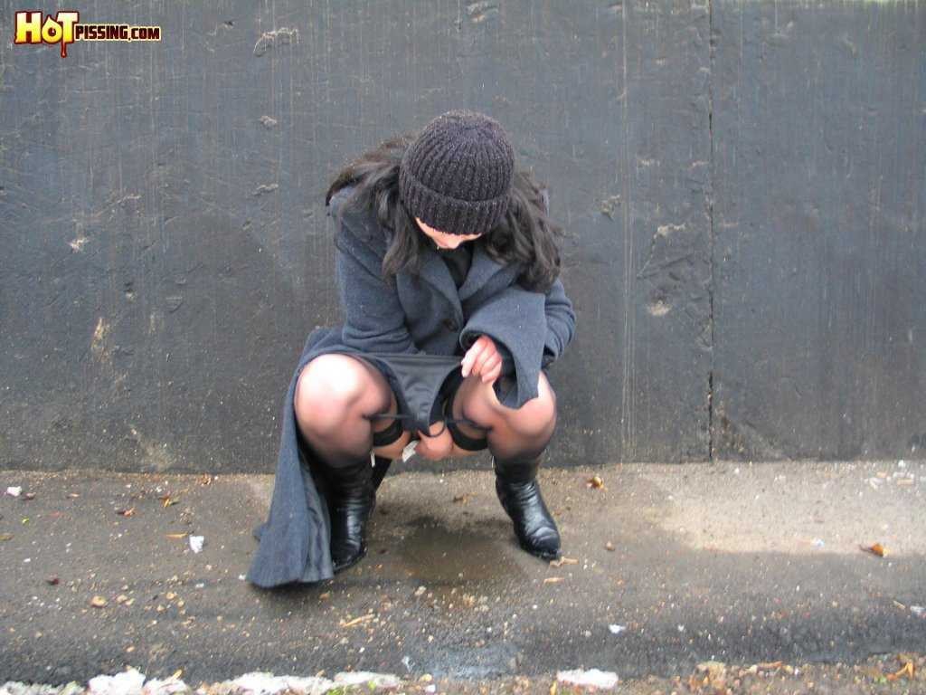 Girl pissing outdoors in the cold #76593301