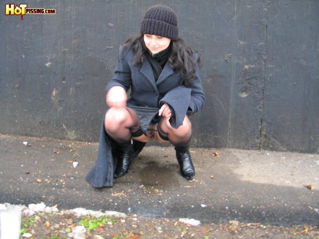 Girl pissing outdoors in the cold #76593305