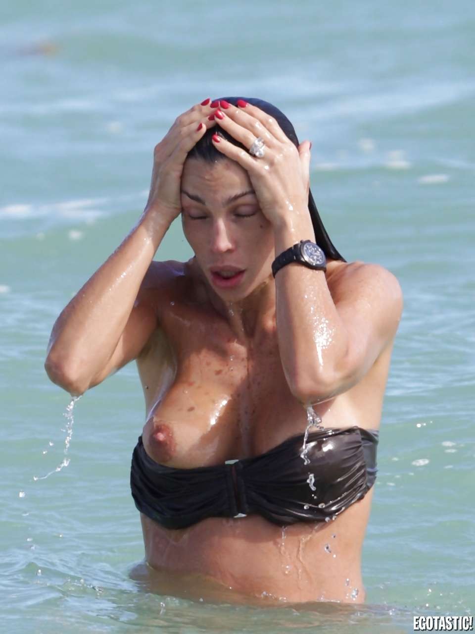 Claudia Galanti showing her nice big boobs on beach paparazzi pictures #75279869