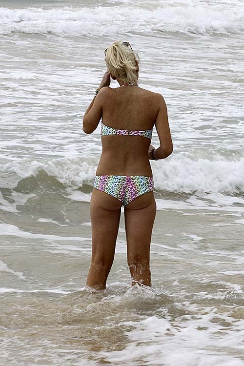Lindsay Lohan exposing sexy body and hot ass in colorful bikini on beach
