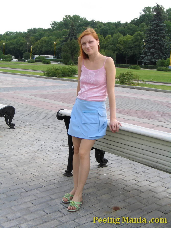 Playful babe empties her bladder sitting on the bench back in the park #76568617