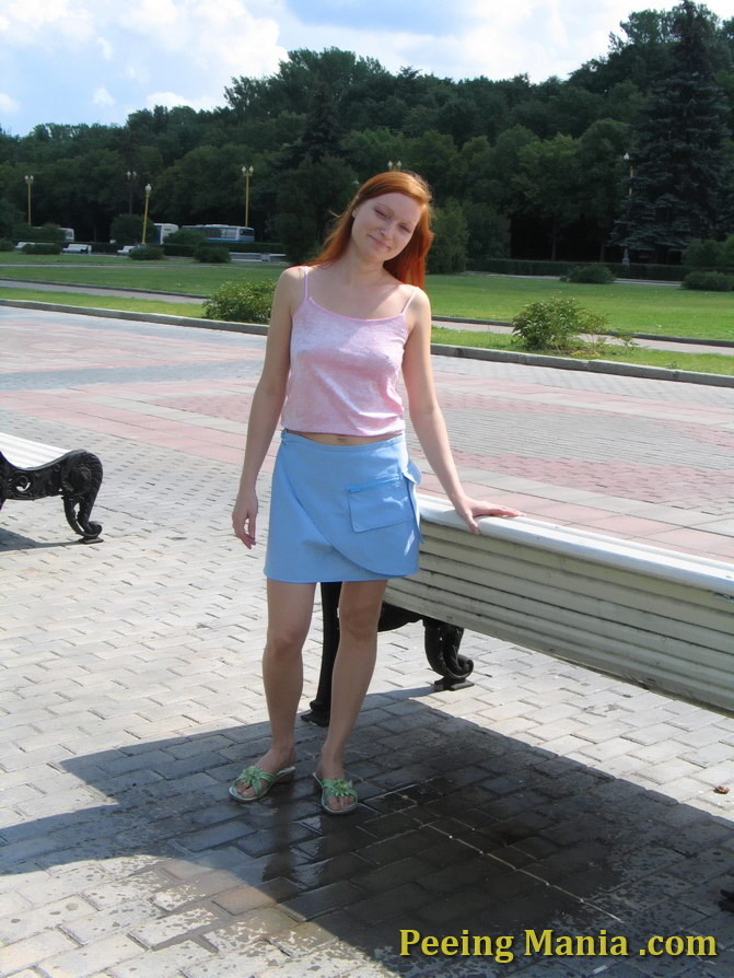 Playful babe empties her bladder sitting on the bench back in the park #76568734