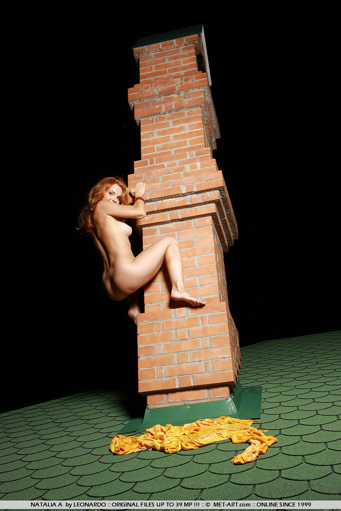 Sublime redhead beauty naked on a roof top #71586390