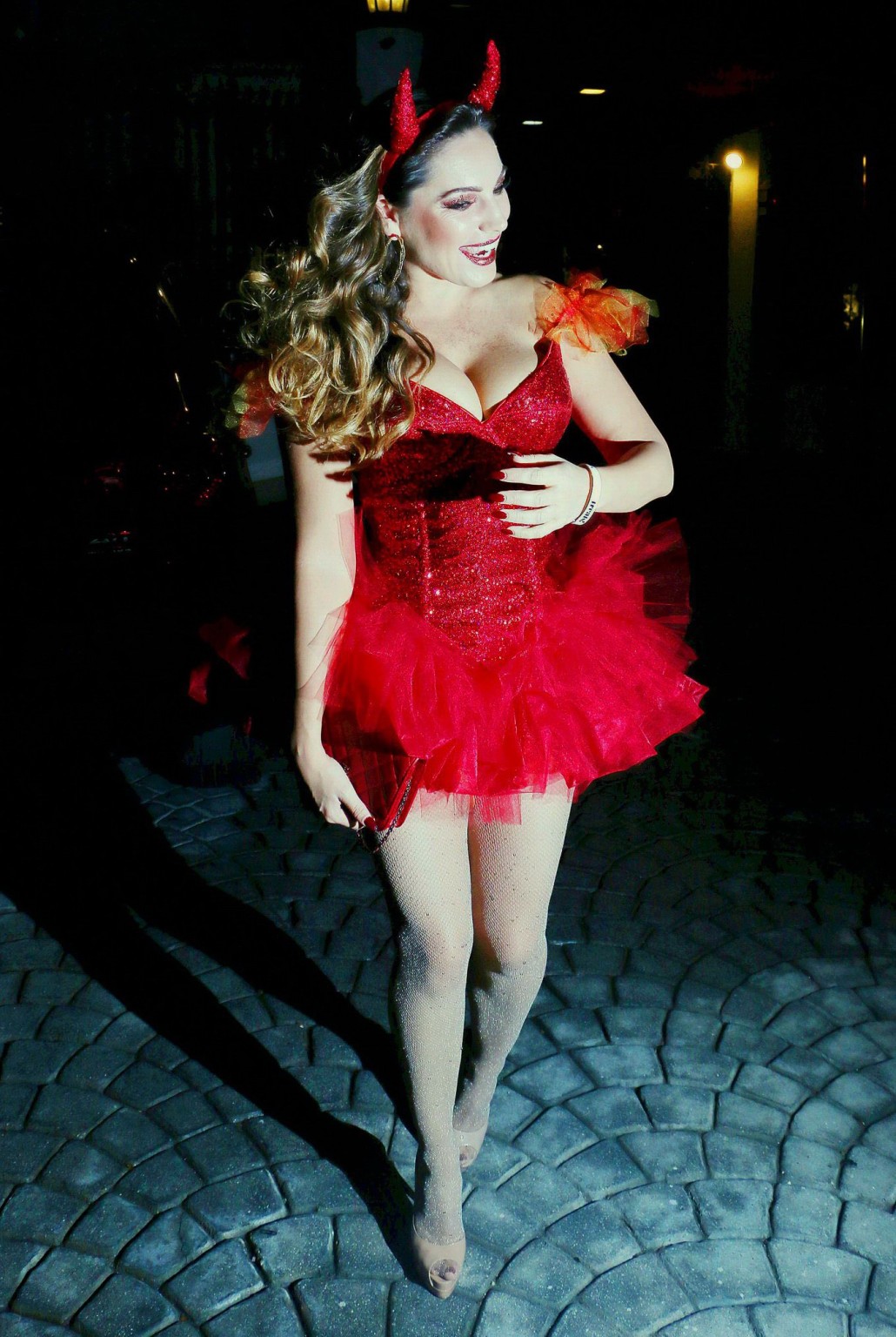 Kelly Brook busty and leggy in tiny red devil costume and stockings at Halloween #75182327